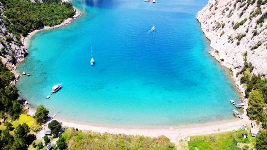 Antalya/Kemer: Porto Genoese Boat Trip & Mud Bath with Lunch - Korsan Bay: your calmer second swim before the ride back