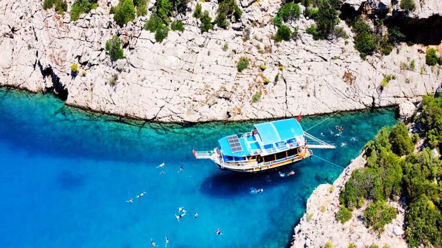 Antalya/Kemer: Porto Genoese Boat Trip & Mud Bath with Lunch - The boat experience: boutique feel, guided by multilingual staff